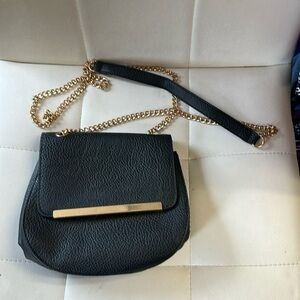 Black small bag with gold accent chain Crossbody style